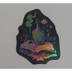 10/$10 Potion Vial & Candle On Open Book Reflective Sticker 2" x 1.5" (AB)